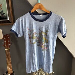 Vintage Blue Ringer T-Shirt with Graphic Print